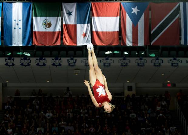 Rosannagh MacLennan, of Canada, performs on her way to winning the gold medal during trampoline finals at the Pan Am Games in Toronto.