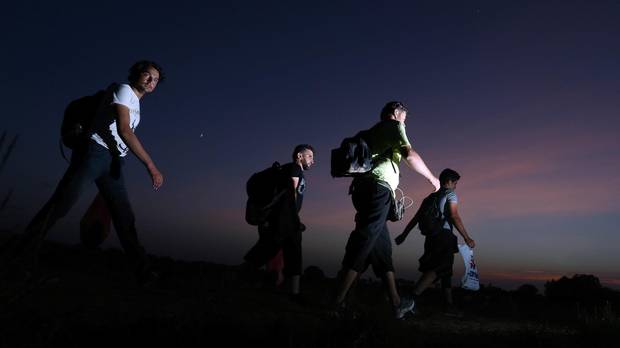 Migrants walk towards the eastern-Croatia town of Tovarnik, close to the border between Croatia and Serbia in September 2015.