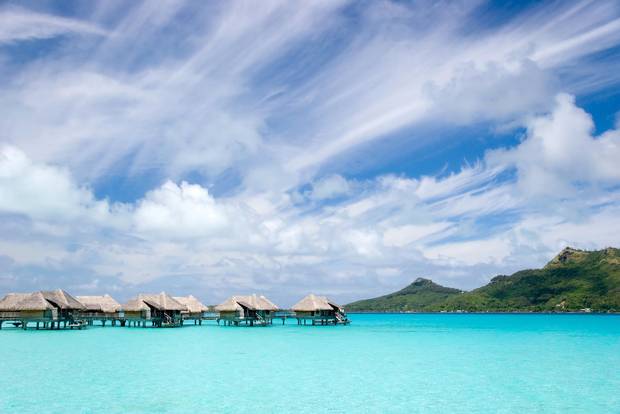 Overwater bungalows at a resort in Bora Bora, French Polynesia. Credit: Getty Images/iStockphoto