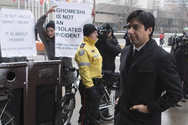 Mr. Ghomeshi walks past demonstrators as he arrives at court on Feb. 9.
