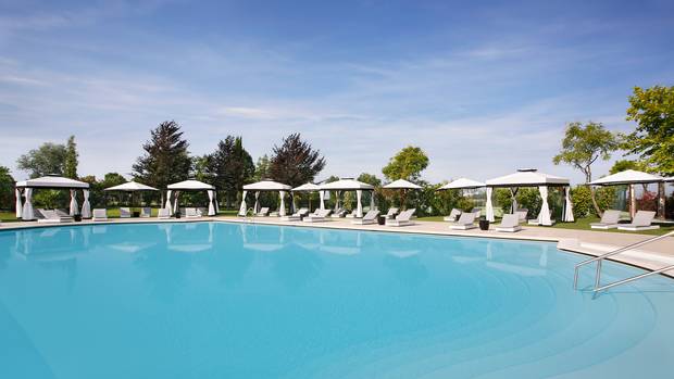 An outdoor pool at the San Clemente Palace Kempinski.