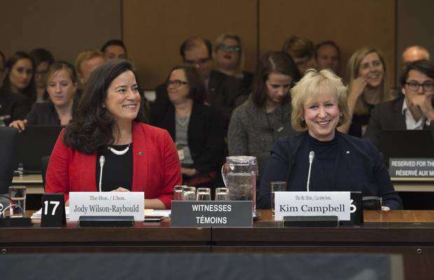 Justice Minister Jody Wilson-Raybould and former prime minister Kim Campbell wait to appear before the Standing Committee on Justice and Human Rights in Ottawa on Oct. 24, 2016.