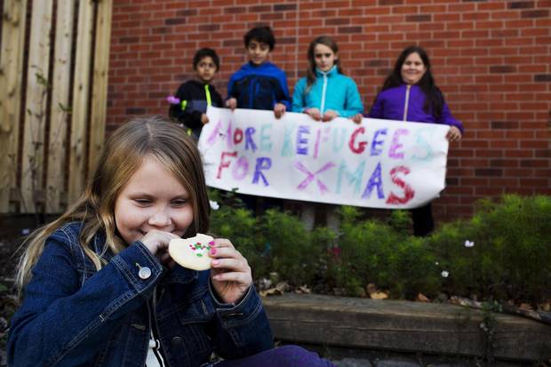 Fiona, 9, and her fellow students are selling baked goods to raise funds for refugees in Toronto.
