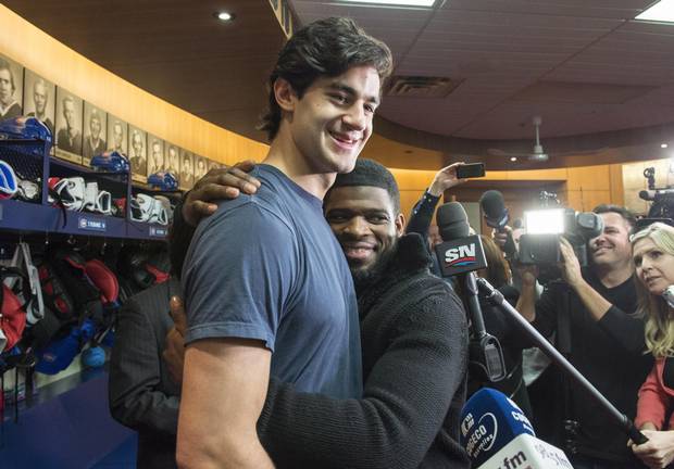 As a demonstration of goodwill, Montreal Canadiens defenceman P.K. Subban, right, hugs captain Max Pacioretty on Monday.