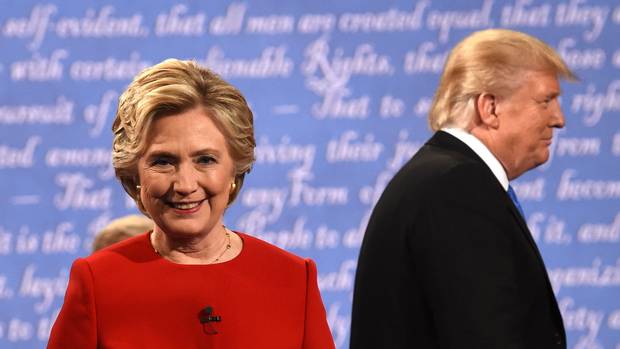 Democratic nominee Hillary Clinton and Republican nominee Donald Trump leave the stage after the first presidential debate at Hofstra University in Hempstead, N.Y., on Sept. 26, 2016.