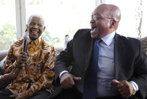 Former South African president Nelson Mandela, left, celebrates his 91st birthday alongside long-time friend Jacob Zuma in Johannesburg in 2009.