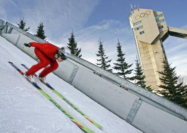 Ski jumper Trevor Morrice tucks down the track before soaring during a training session at Canada Olympic Park in Calgary on Dec. 23, 2006.