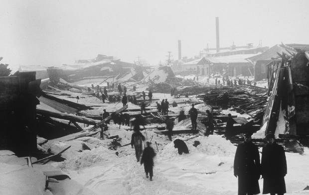 People walk through the ruins of Halifax after two ships collided in the city’s harbour.