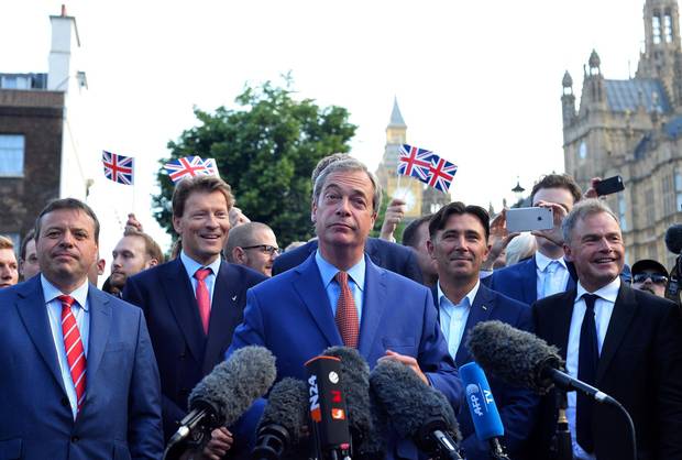 Nigel Farage, middle, leader of the United Kingdom Independence Party, speaks during a press conference near the Houses of Parliament in central London on June 24, 2016.