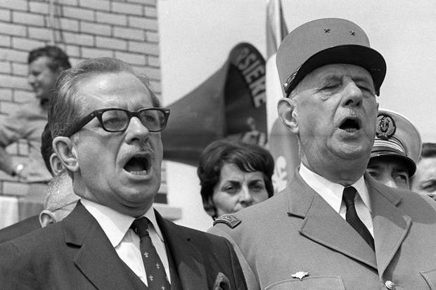 July 24: Quebec’s premier Daniel Johnson sings the national anthem in Montreal with Gen. de Gaulle.