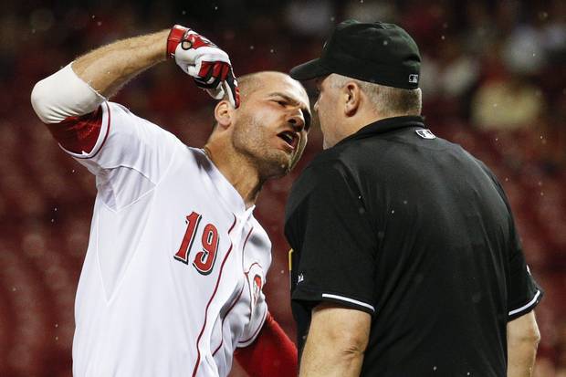 Cincinnati Reds' Joey Votto (19) argues with umpire Bill Welke after being thrown out of the game for arguing balls and strikes during the eighth inning of a baseball game against the Pittsburgh Pirates, Wednesday, Sept. 9, 2015, in Cincinnati.