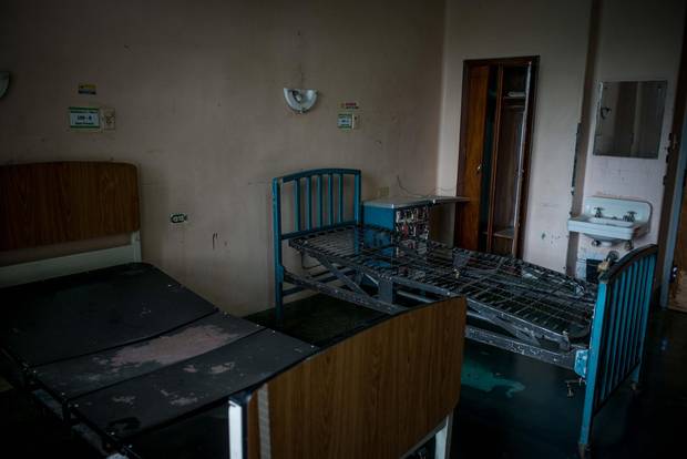 A two-bed room at Clinic University Hospital, unusable due the lack of cleaning supplies, bathrooms and mattresses.