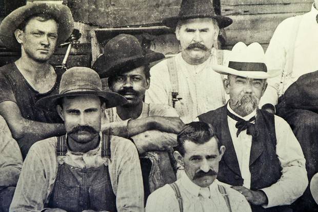 An undated photo of Jack Daniel (wearing white hat) and an unidentified black man who may be Nearest Green or one of his sons.