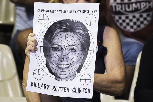 A supporter holds a target with Hillary Clinton’s face on it at a Trump rally in Sarasota, Fla., on Nov. 7.