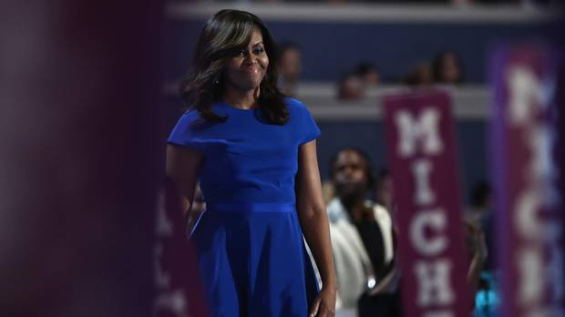 First lady Michelle Obama walks on stage before delivering remarks on the first day of the Democratic National Convention at the Wells Fargo Center, July 25, 2016 in Philadelphia, Pennsylvania.