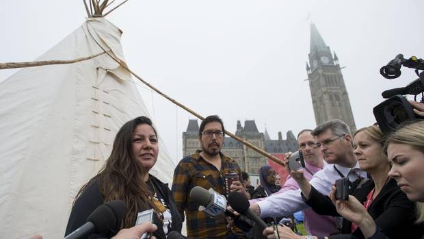 Candace Day Neveau speaks to reporters after Prime Minister Justin Trudeau met with people in a teepee on Parliament Hill in Ottawa on Friday, June 30, 2017. 