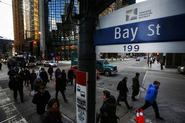 People walk down Bay Street in Toronto's Financial District in January of 2015.