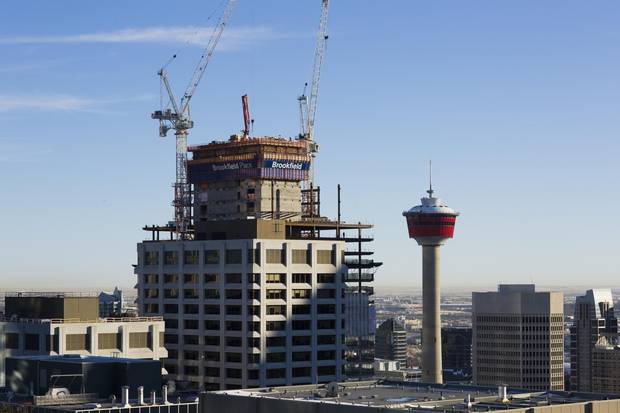 An office tower takes shape in Calgary, while demand for space continues to plummet.