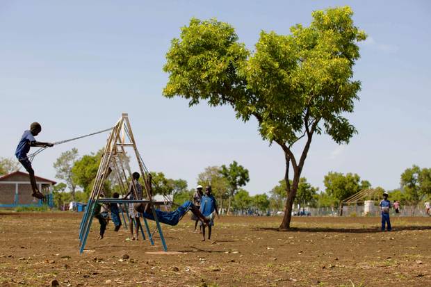 Unaccompanied children who travelled alone alone from South Sudan to the Ethiopian border, play on swings at the children friendly space of Plan International Nguenyyiel refuge camp in Gambela, Ethiopia, on June 29, 2017.