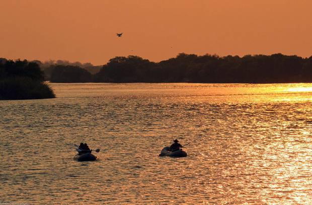 The Zambezi traces the border between Zambia and Zimbabwe, providing fleeting glimpses of day-to-day life on the famous river.