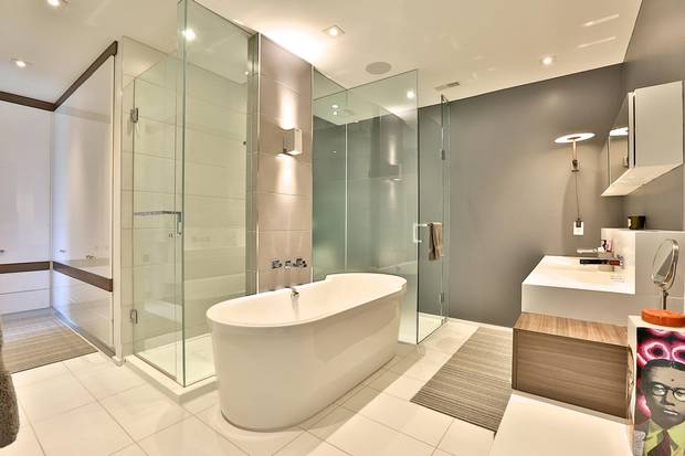 The ensuite bathroom features a soaker tub.