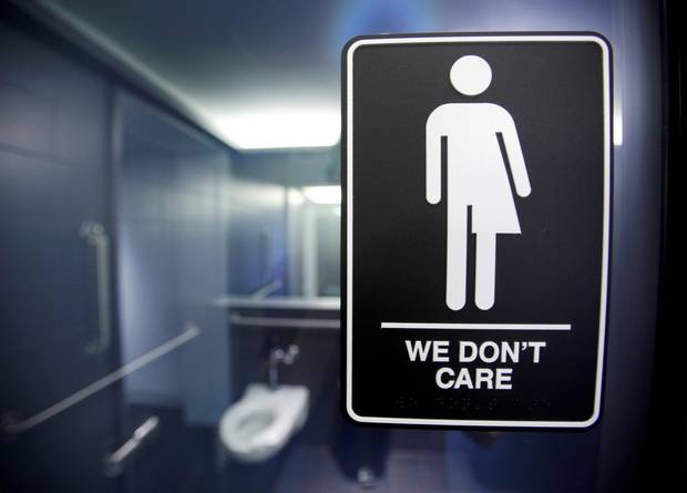 A sign protesting a North Carolina law restricting transgender bathroom access is seen in Durham on May 3, 2016.