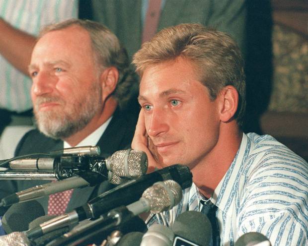 Wayne Gretzky and Edmonton Oilers' owner Peter Pocklington attend a news conference in Edmonton after Gretzky was traded to the Los Angeles Kings, Aug. 9, 1988. While the NHL's introduction of a salary cap has made it more difficult for teams to make trades, there's still a long history of wheeling and dealing.