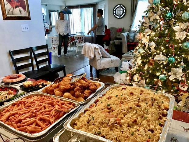 photos from Carol Gomez and her family's holiday traditions. Food from the Gomez’s traditional potluck for Noche Buena.