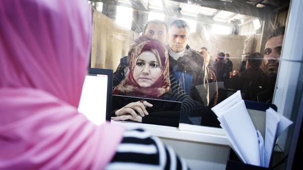 Syrian refugees line up at the UNHCR registration office in Amman, Jordan in November 2015 for an interview that would determine whether they are eligible for a second interview by Canadian authorities.