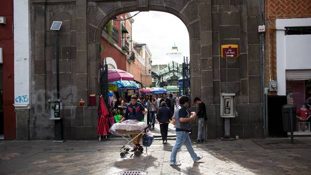 People and vendors in the main plaza of Puebla, Mexico.