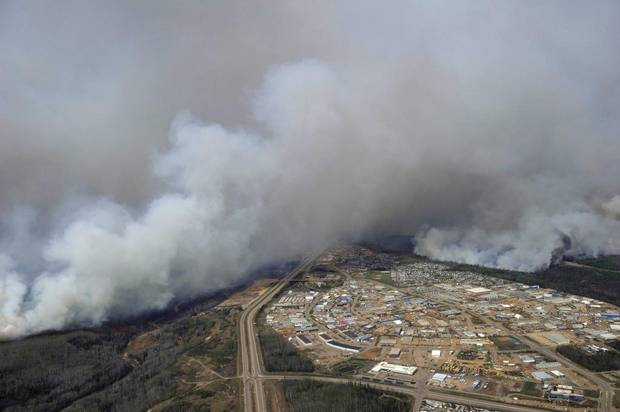 A Canadian Joint Operations Command aerial photo shows wildfires near neighborhoods in Fort McMurray Wednesday posted on social media.