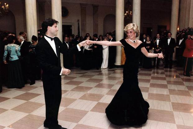 In this Nov. 9, 1995 photo provided by the Ronald Reagan Library, actor John Travolta dances with Princess Diana at a White House dinner. (AP Photo/Ronald Reagan Library)