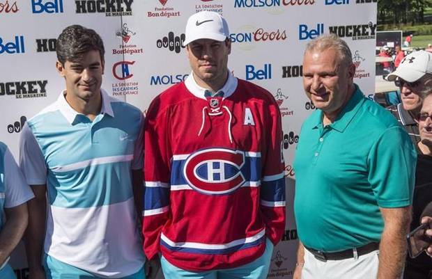 Montreal Canadiens head coach Michel Therrien (right) stands next to newly-acquired defenceman Shea Weber, centre, and captain Max Pacioretty at the Michel Therrien Golf Invitational Tuesday, August 9, 2016 in Terrebonne, Que. Therrien denies ever calling Pacioretty 