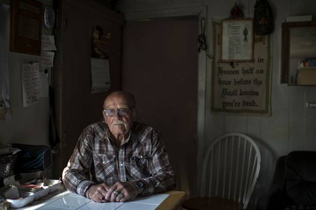 Jackie Vautour, 88, sits in the shack where he lives in the middle of New Brunswick’s Kouchibouguac National Park. The province expropriated the land in the 1970s, but while all other ex-residents of the park land have moved on, he has not.
