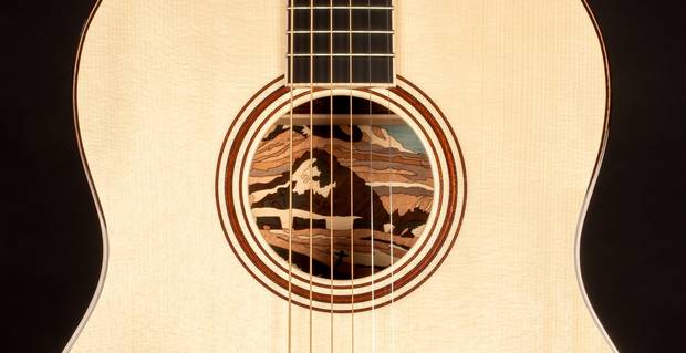Jean Larrivée says he wanted his guitar to showcase the artist it was inspired by – in this case, A.Y. Jackson – so he created a 200-piece mosaic recreating a Jackson painting inside the instrument’s body.