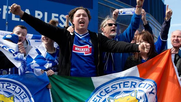 Leicester City football fans celebrate outside the King Power Stadium in Leicester, central England, on May 3, one day after the team won the English Premier League title.