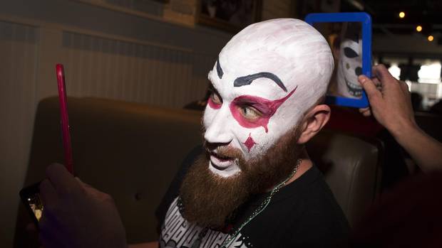Aaron Breitkreutz gets his head painted at Canadian Juggalo Weekend.