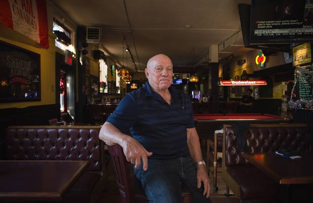 Bobby Taylor, the former CFL player and hockey player now runs the Black Bull in Toronto. He is photographed in the bar on November 25, 2015.