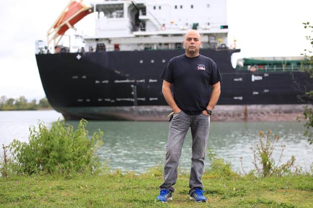 John Marsala, 45, stands beside the Welland Canal in St. Catharine’s, Ont., near the drydocks where he used to work.