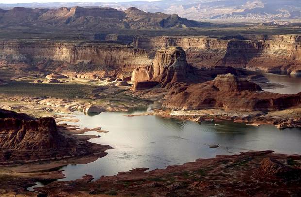 Huge areas of dry ground, which would be under water when the lake is full, are seen at Lake Powell near Page, Ariz., on May 26, 2015. Lake Powell on the Colorado River provides water for Nevada, Arizona and California.