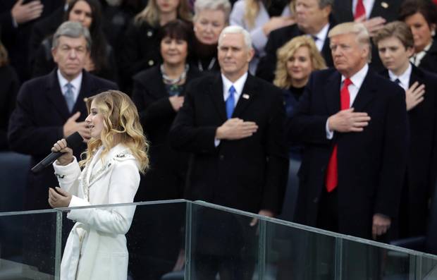 Jackie Evancho performs the national anthem as Vice-President Mike Pence and President Donald Trump watch.