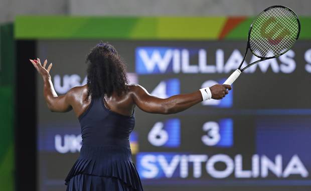 Serena Williams, of the United States, throws up her arms as she faces the scoreboard while trailing Elina Svitolina, of Ukraine, during the second set at the 2016 Summer Olympics in Rio de Janeiro, Brazil, Tuesday, Aug. 9, 2016