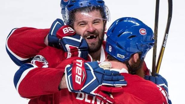 Montreal Canadiens' Alexander Radulov celebrates his game winning goal against the New York Rangers with teammate Jordie Benn during overtime Game 2 NHL Stanley Cup first round playoff hockey action Friday, April 14, 2017 in Montreal. The Canadiens beat the Rangers 4-3 to tie the series at 1-1. THE CANADIAN PRESS/Paul Chiasson