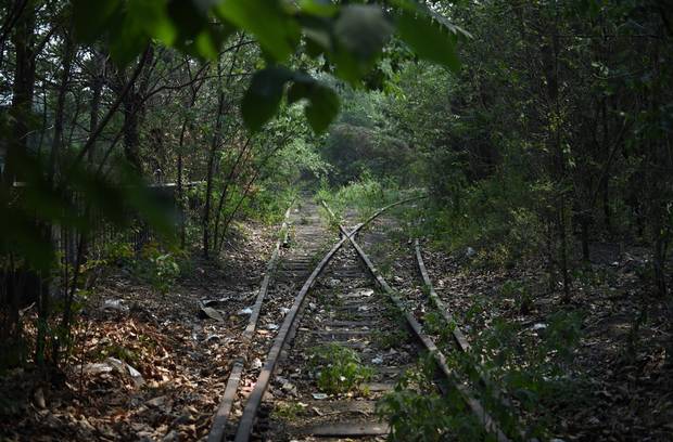 An abandoned rail line is seen at the plant.