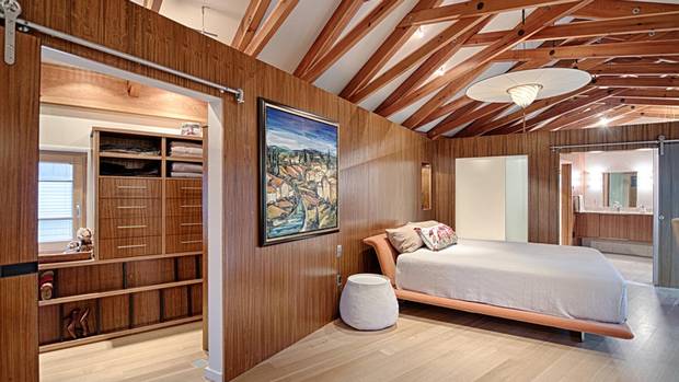 “All the timber framing you see – in the master bedroom for instance – is reclaimed wood from an airline hanger,