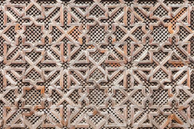 FES, MOROCCO - FEBRUARY 27, 2016: Pattern design element of Madrasa Bou Inania in Fes in Morocco. Madrasa Bou Inania is known as an excellent example of Marinid architecture