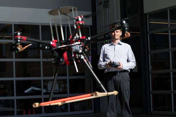 University of Waterloo professor Steven Waslander flies a drone.