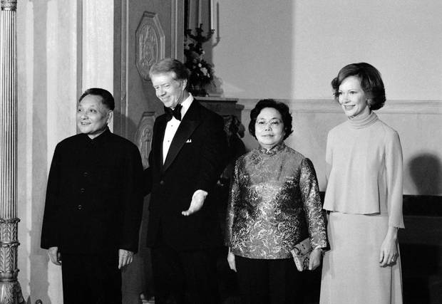 President Jimmy Carter escorts Chinese Vice President Deng Xiao-ping and his wife Cho Lin as he and first lady Rosalynn Carter host China at the 1979 a state dinner.
