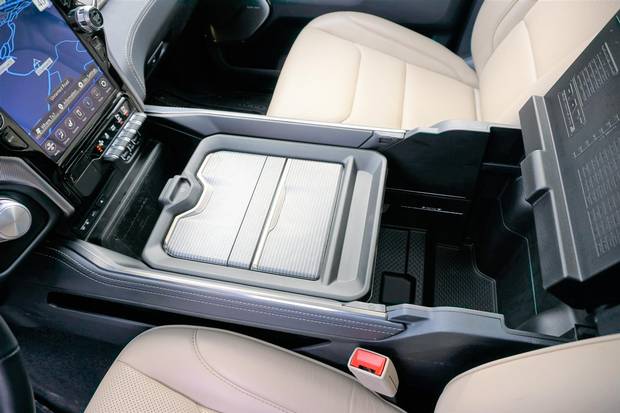 The centre console opens to offer ample storage space.