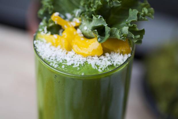 Green Machine smoothie made with avocado, kale, coconut milk and immunity powder.